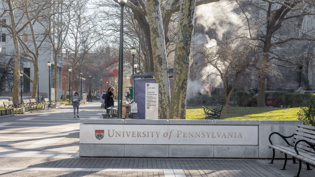 a walkway with a sign reading “University of Pennsylvania"