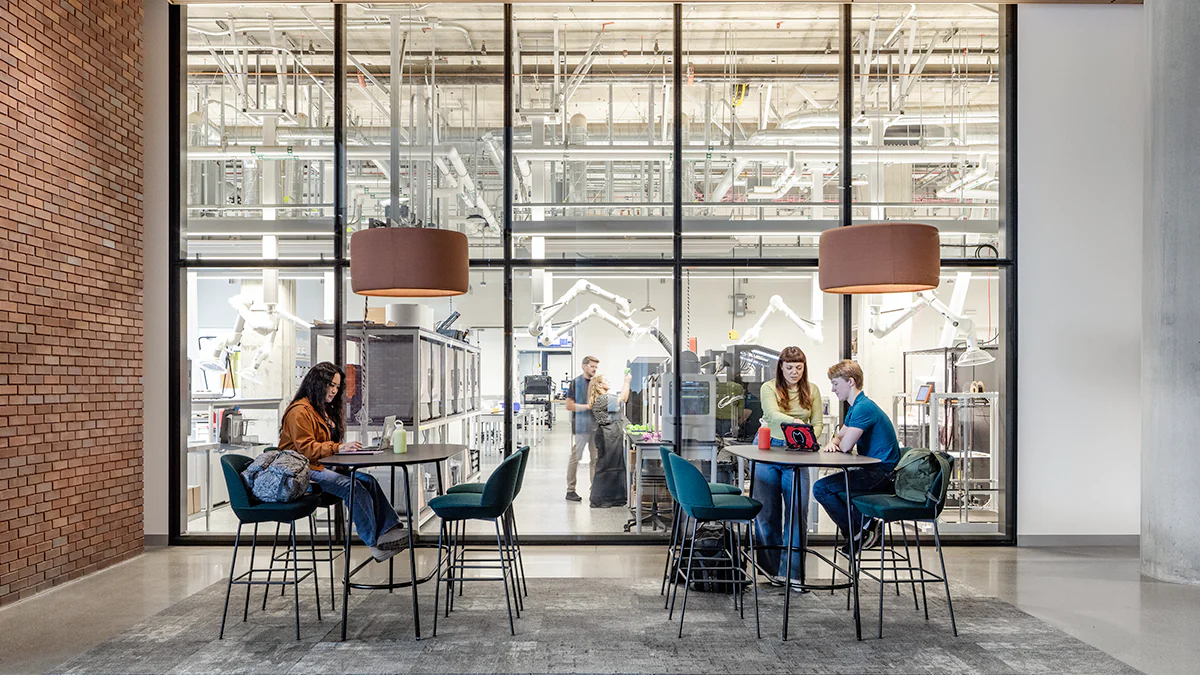 People sit outside of the Tech Foundry, a makerspace at Aggie Square that designs and manufactures devices to support research and solve problems.
