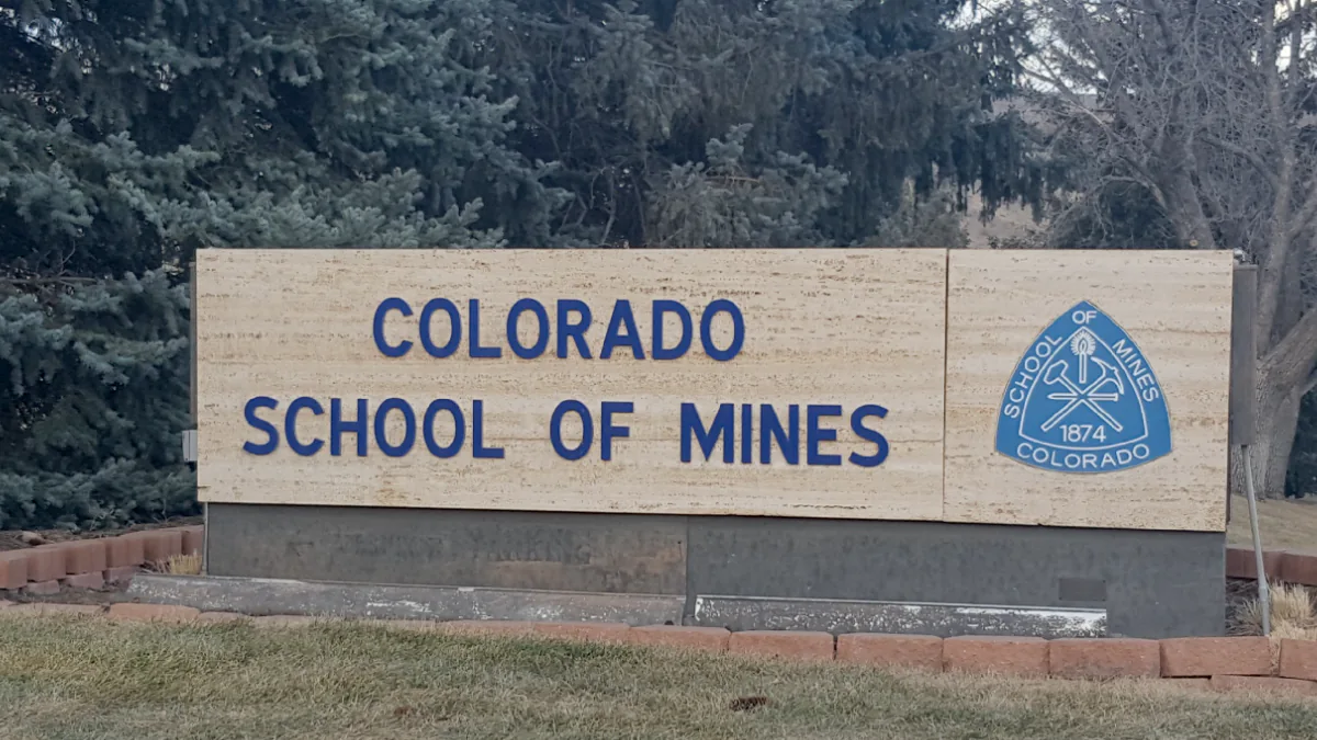 a sign reading "Colorado School of Mines", with the university emblem on the right of the text